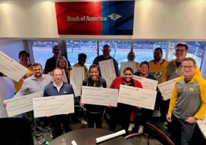 Representatives from 13 Nashville nonprofits celebrate receiving grants from Bank of America at a Nashville Predators game on April 24.