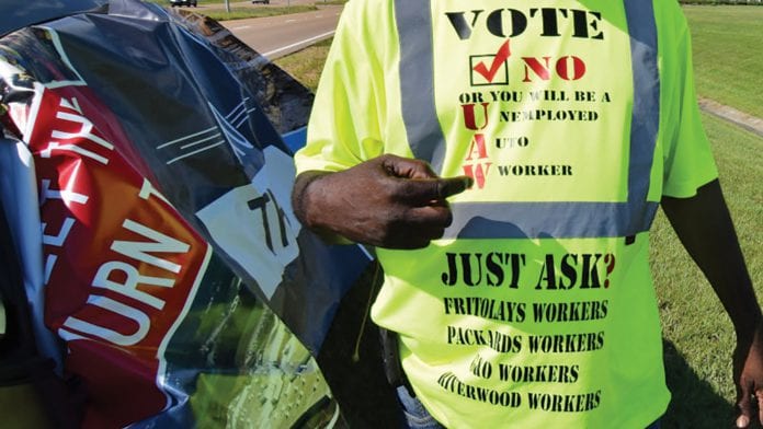 Nissan worker Tony Jacobson shows off a t-shirt made to show why he opposes the United Auto Workers unionÕs attempts to unionize the automakerÕs plant in Canton
