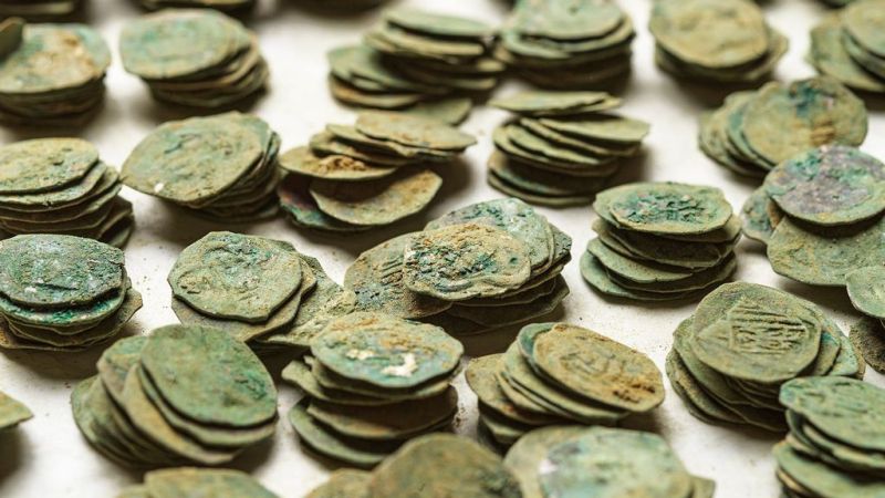 Some of the Pfennigs that were among the more than 6,000 coins recently found at a farm renovation site in Austria. (Michael Maritsch/Zenger)