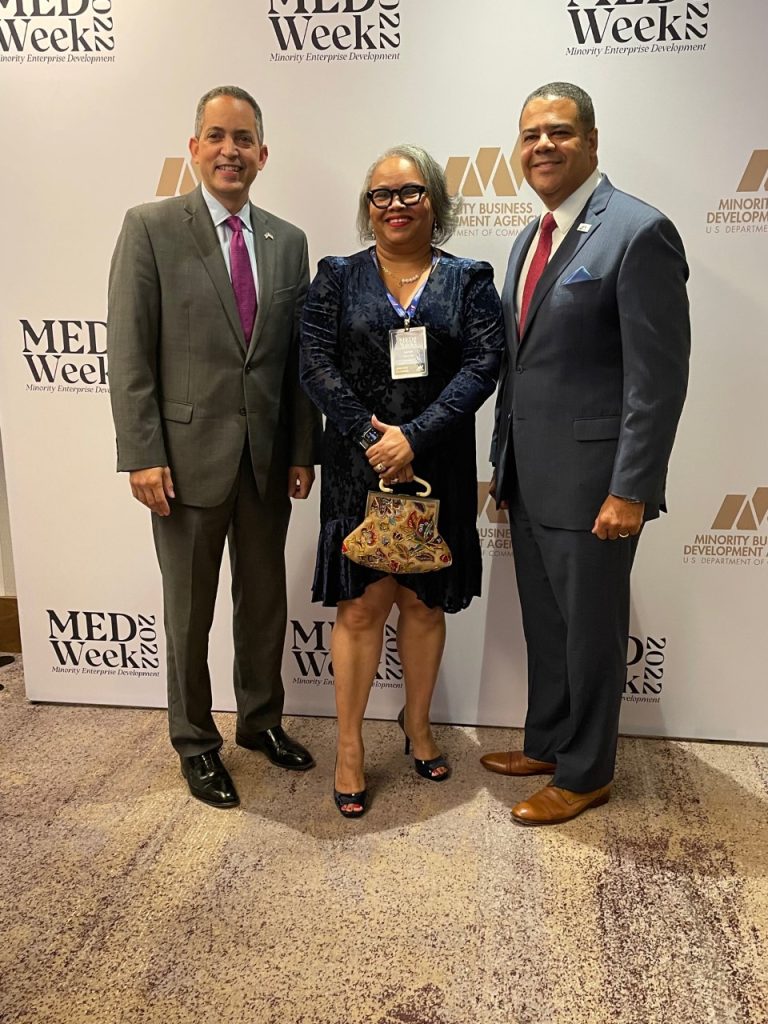 Deidre Malone, president/CEO of The Carter Malone Group, LLC., is joined by U.S. Department of Commerce Deputy Secretary Don Graves (left) and Under Secretary for Minority Business Development Donald Cravins Jr. after winning The Minority Marketing and Communications Firm of the Year award. (Courtesy photos)