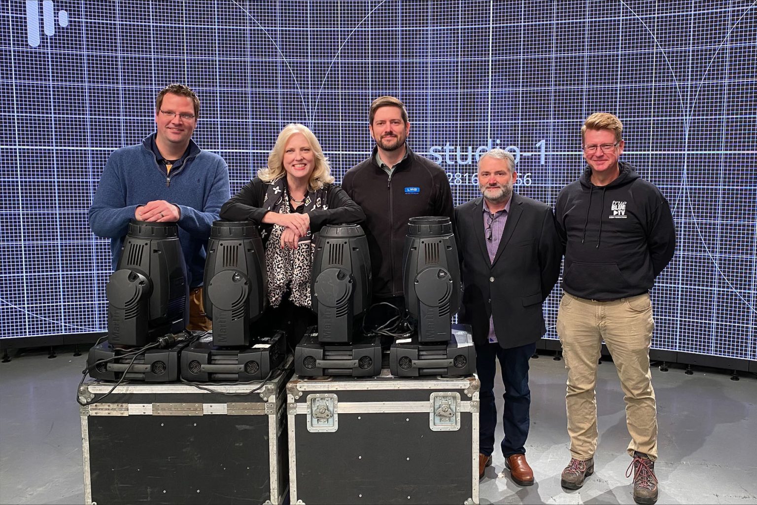 Representatives from Middle Tennessee State University and audiovisual provider LMG Inc. are shown inside a studio in the Bragg Media and Entertainment Building earlier this spring with some of the almost $20,000 in lighting equipment that LMG donated to the Department of Media Arts to help train students. Pictured, from left, are Michael Forbes, director of technical systems for MTSU’s Department of Media Arts; Beverly Keel, dean of the College of Media and Entertainment; Earl Hoback of LMG; Shane Smith of LMG; and Robert Mogensen, director of True Blue TV Events Production. (Photo courtesy of Charles Scudder)