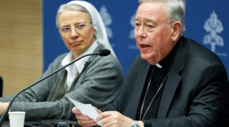 Cardinal Jean-Claude Hollerich, relator general of the synod on synodality, speaks during a news conference at the Vatican March 14, 2024, about study groups authorized by Pope Francis to examine issues raised at the synod. Looking on is Consolata Missionary Sister Simona Brambilla, secretary of the Dicastery for the Institutes of Consecrated Life and the Societies of Apostolic Life. (CNS photo/Lola Gomez)