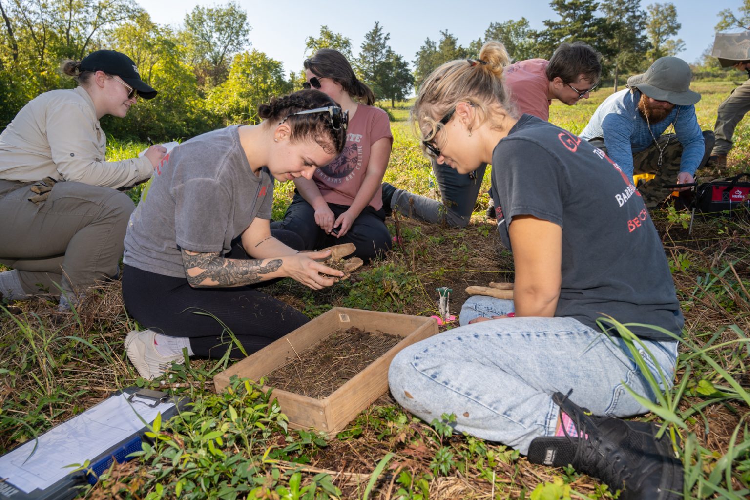 Students in the Introduction to Archaeology at Middle Tennessee State University in Murfreesboro, Tenn., are getting hands-on with history through ongoing research each semester with the Bass Street Community Archaeology Project at Fort Negley Park in Nashville, Tenn. Digging together at the site in October 2024 are, front from left, Rhiannon Nourse and Lexi Guza, and back, from left, community volunteers Katharine Bogen and Madeline Laderoute, and students Jackson Edwards and Michael Sutherland. (MTSU photo by James Cessna)