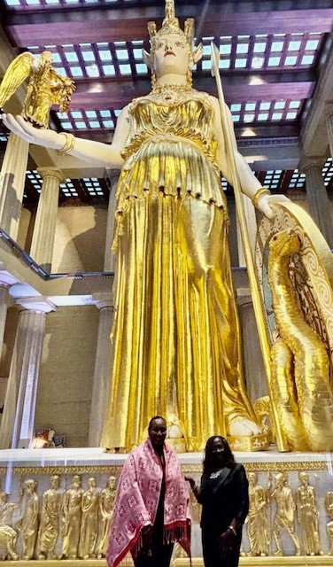 ATHENA Recipients Dr Phyllis Qualls and Dr. Katherine Y. Brown stand in front of the Nashville AThANA statue