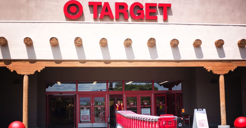 Santa Fe, NM: A Target employee pulls red shopping carts into the Santa Fe NM store. Santa Fe’s Target is constructed in the Southwest Pueblo architectural style. (Photo by Jann Huizenga)