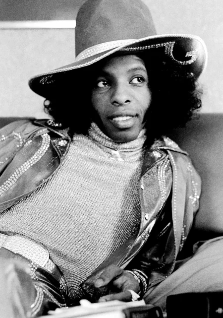 Sly Stone in 1973. Though he eventually receded from center stage, his vibrant, intricately arranged songs left their mark on countless artists.Credit...Michael Putland/Getty Images