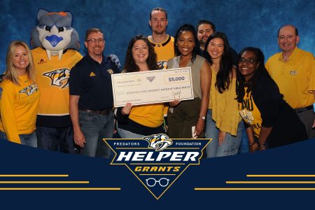 Austin Peay State University faculty and staff representatives receive a $5,000 Helper Grant from the Nashville Predators Foundation to support the Community LIFT Project, an early childhood literacy initiative. | Contributed photo