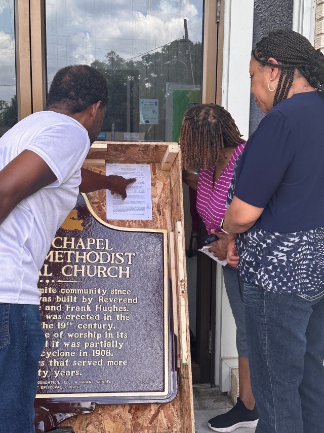 Wintrop Walker, Vera Wheeler, and Ella G. Williams preview the historical marker to be erected at Grant Chapel AME Church in Amite, La. Photo by Antoinette Harrell.
