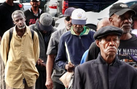 Men line up outside the Soup Kitchen at St. Mary’s Catholic Church in Downtown Memphis. A bill passed last week by the U.S. House of Representatives would slash the Supplemental Nutrition Assistance Program and Medicaid. (by Karen Pulfer Focht)