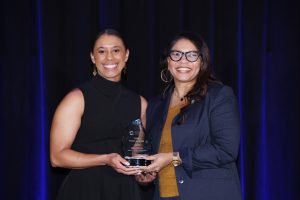 Erinn McGee of John B. Whitsitt Elementary School receiving her award from Superintendent Dr. Adrienne Battle.